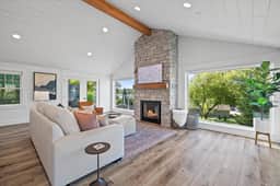 Enjoy a large Pottery Barn coach and leather chair while enjoying the gas fire place of Smart TV.  Or  the lake view never gets old!