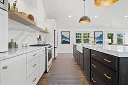 Gourmet kitchen with extra large island with ample serving space and seating for 5