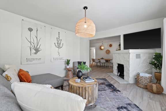 Bright beautiful living room with 65” TV with streaming services  
Fireplace is not functional