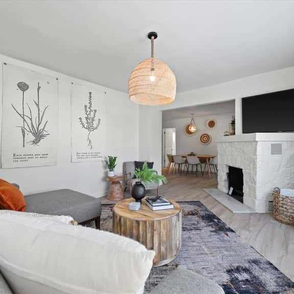 Bright beautiful living room with 65” TV with streaming services  
Fireplace is not functional