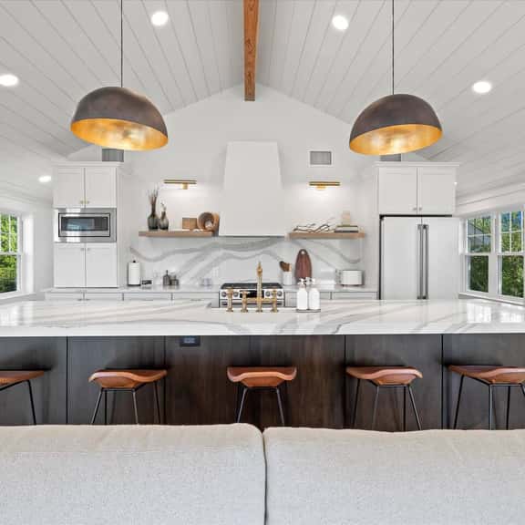 Gourmet kitchen with extra large island with ample serving space and seating for 5