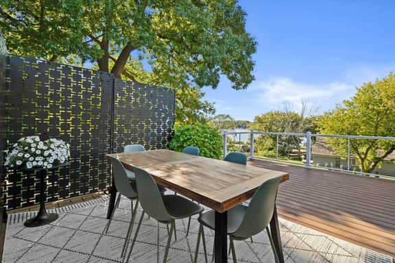 This upper level patio is your perfect hangout spot and take in the lake views while dining.  Seating for 6.   Includes dining table and two lounge chairs with beverage table. 

Table moved indoors during cooler months.
