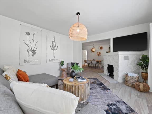 Guest house living room with lounge couch and smart tv
Fireplace is not functional.