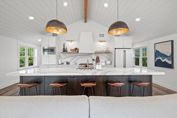 Gourmet kitchen with extra large island with ample serving space and seating for 5